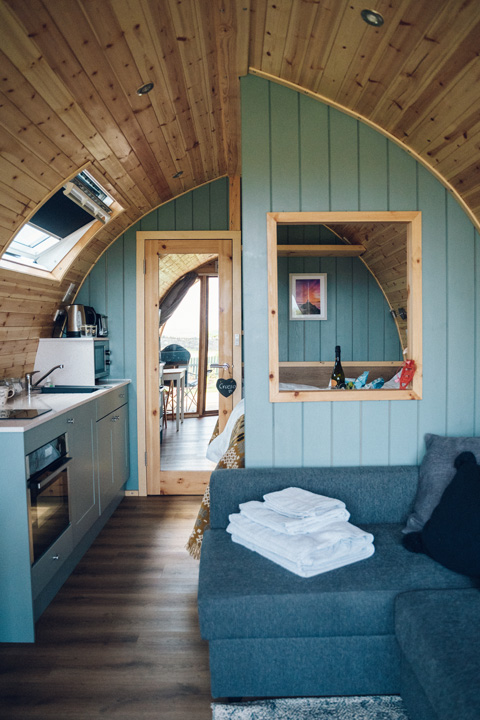 a luxury glamping pod with a blue interior