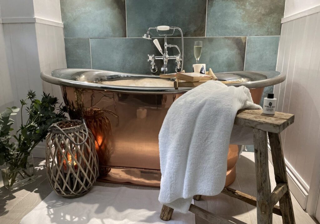 A bathroom designed to completely luxuriate and relax in with a handmade copper bath and separate rainfall shower no3-old-school-house-cawsand-cornwall-beach-house-garden-view.jpg Cawsand, Cornwall, UK Latitude ~50.333, Longitude ~-4.200